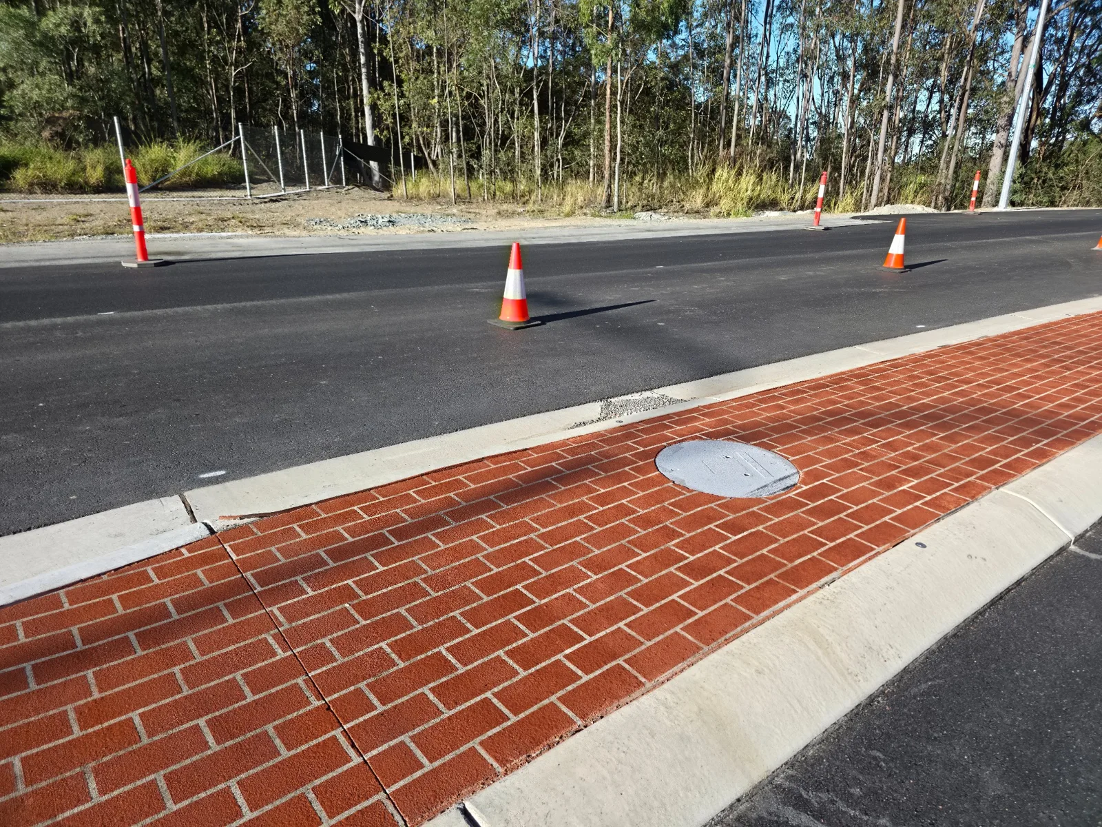 Decorative brick pattern around a service cover