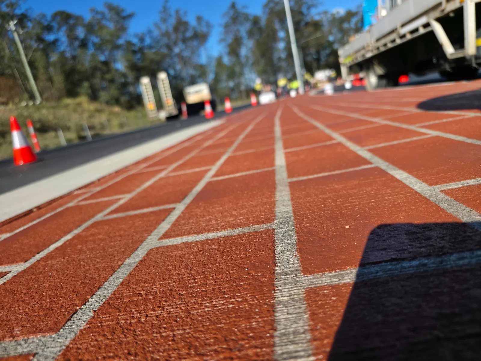 Low-angle detail of the textured red finish and contrasting joints