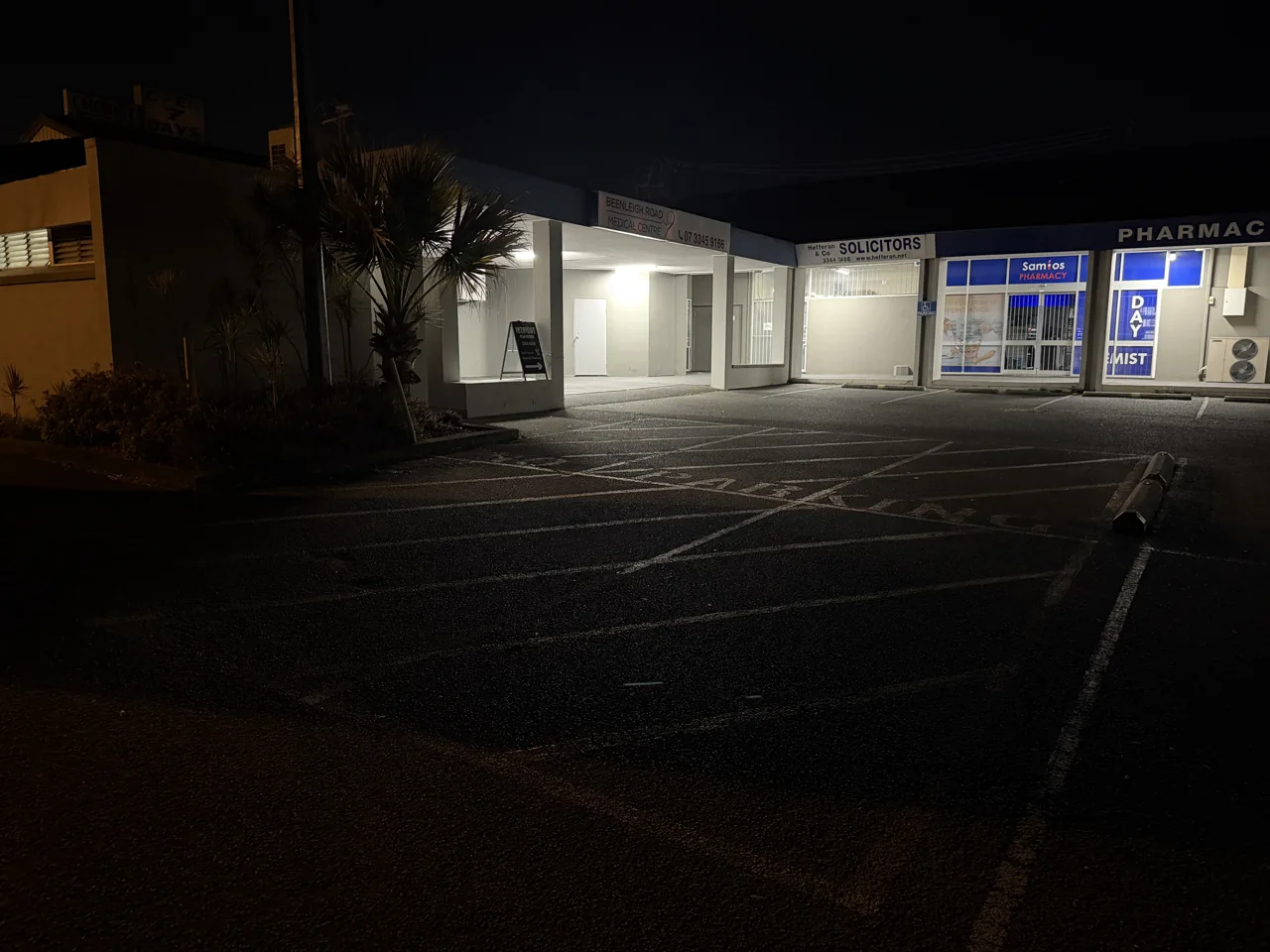 Yellow chevrons and no-parking area in Sunnybank before line marking refresh
