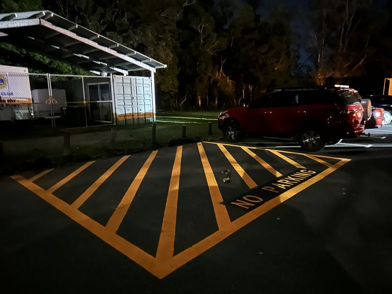 Yellow hatched no parking zone with NO PARKING lettering marked in a car park in Redland Bay
