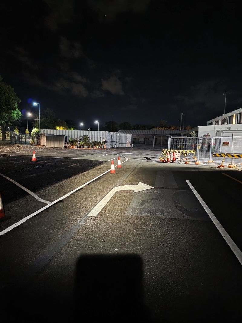 White directional turn arrow marked on an internal roadway on the Gold Coast